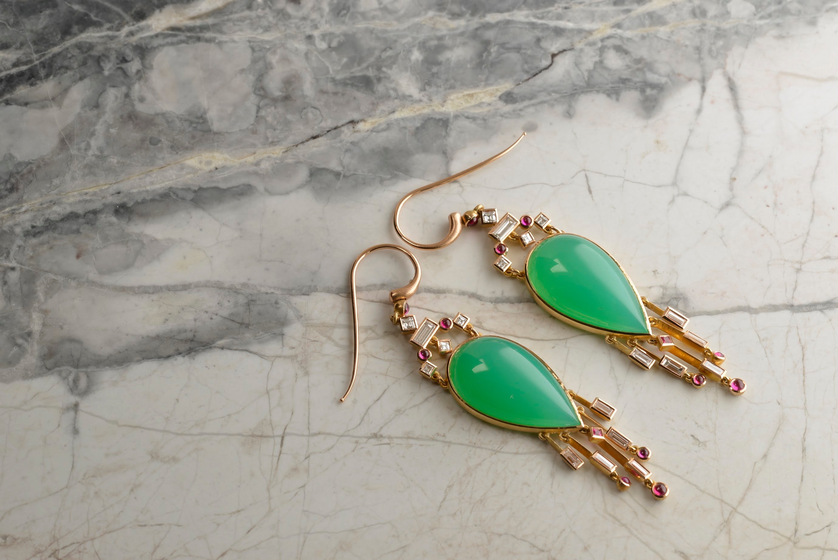Bespoke earrings featuring Australian 30ct pear-shape Chrysoprase cabochons, and diamond and ruby tassels. Handmade in 18ct rose gold by Sydney jeweller Nicky Burles.
