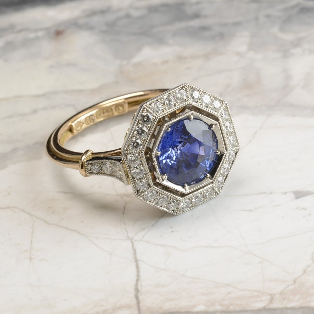 Edwardian style rose gold and platinum custom ring with Sapphire centre stone and an octagonal diamond halo. Handmade by Sydney jeweller Nicky Burles.