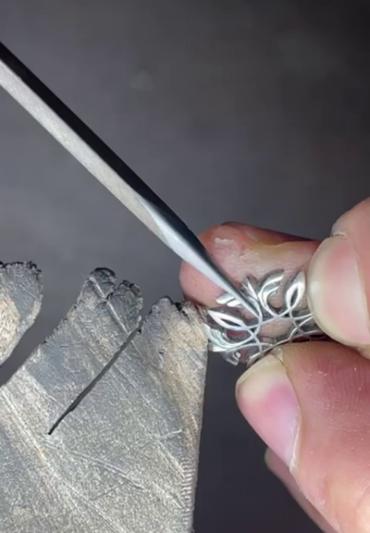 Sydney Jeweller Nicky Burles filing a handmade basket for sapphire centre stone