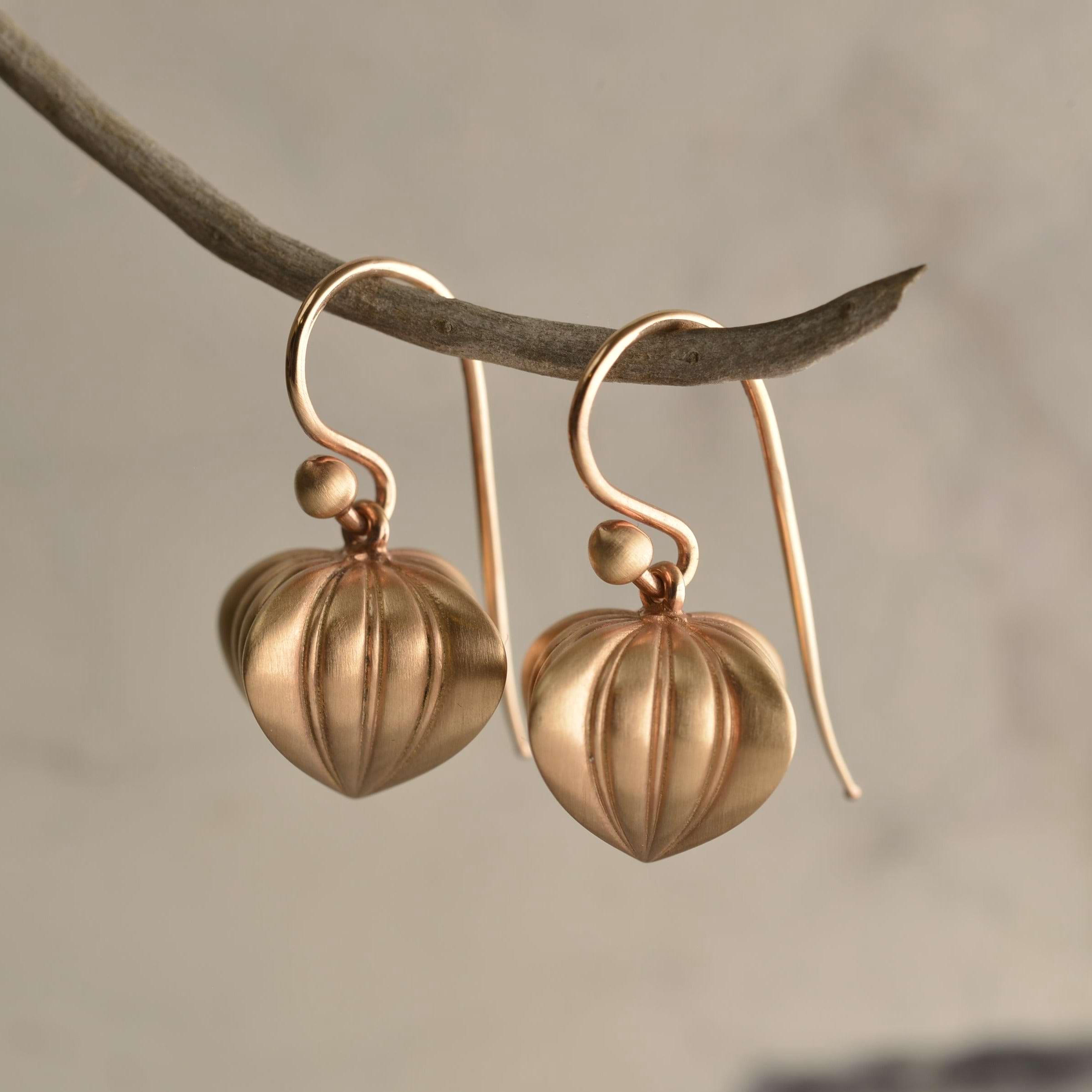 Romantic 9ct rose gold earrings crafted into Georgian heart silhouettes hanging from a branch. Handcrafted by Sydney jeweller Nicky Burles.