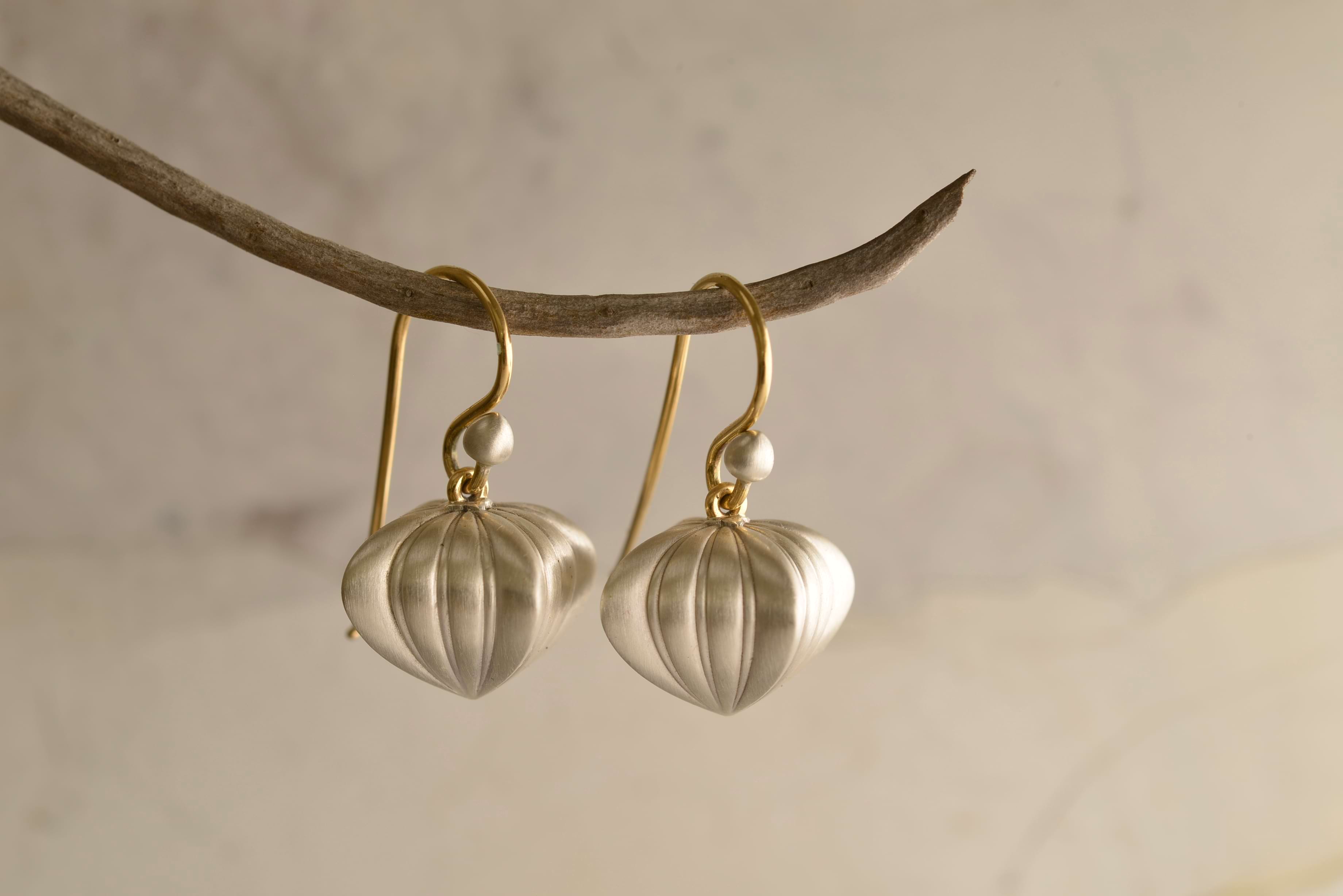 Vintage-style silver earrings shaped as Georgian hearts hanging from branch. Handcrafted by Sydney jeweller Nicky Burles.