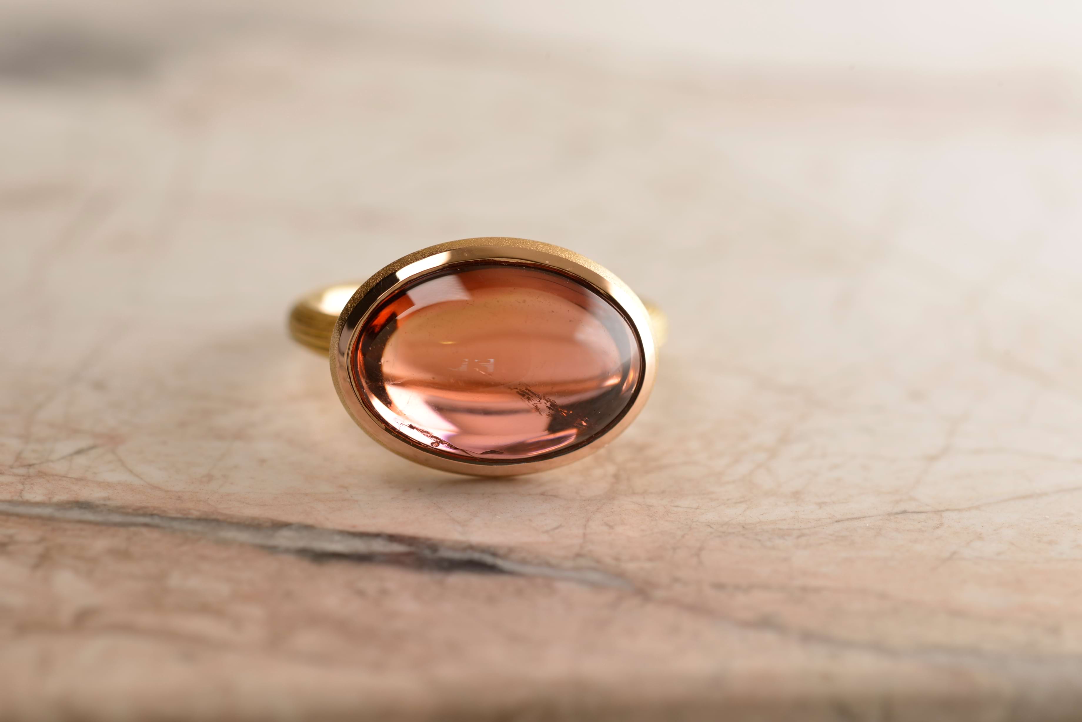 Front view of 7.7 carat pink/orange Tourmaline ring. Handmade in 18 carat rose gold by Sydney jeweller Nicky Burles.