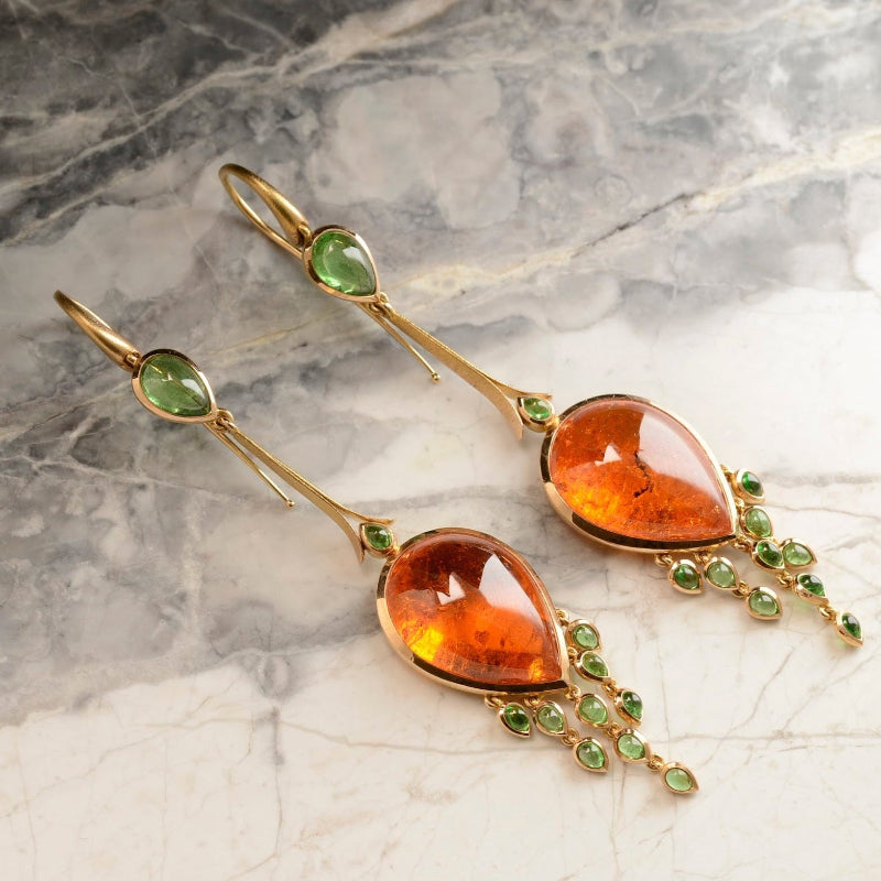 Custom earrings with Mandarin garnet centrestone and tsavorite garnet tassels in rose gold. Handmade by Sydney jeweller Nicky Burles.