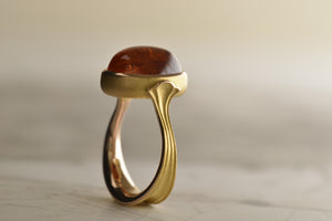 Signature Nicky Burles Lotus ring, features a 17 carat Mandarin Garnet