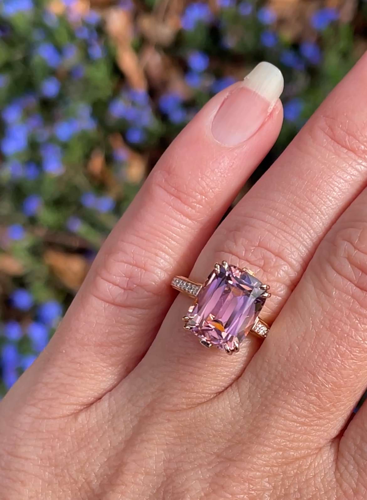 Art deco inspired bespoke rose gold ring on hand. Features a 5.56ct pink antique cushion cut Afghan tourmaline set in double claws and with 36 diamonds set on the band. Handmade by Sydney jeweller Nicky Burles.