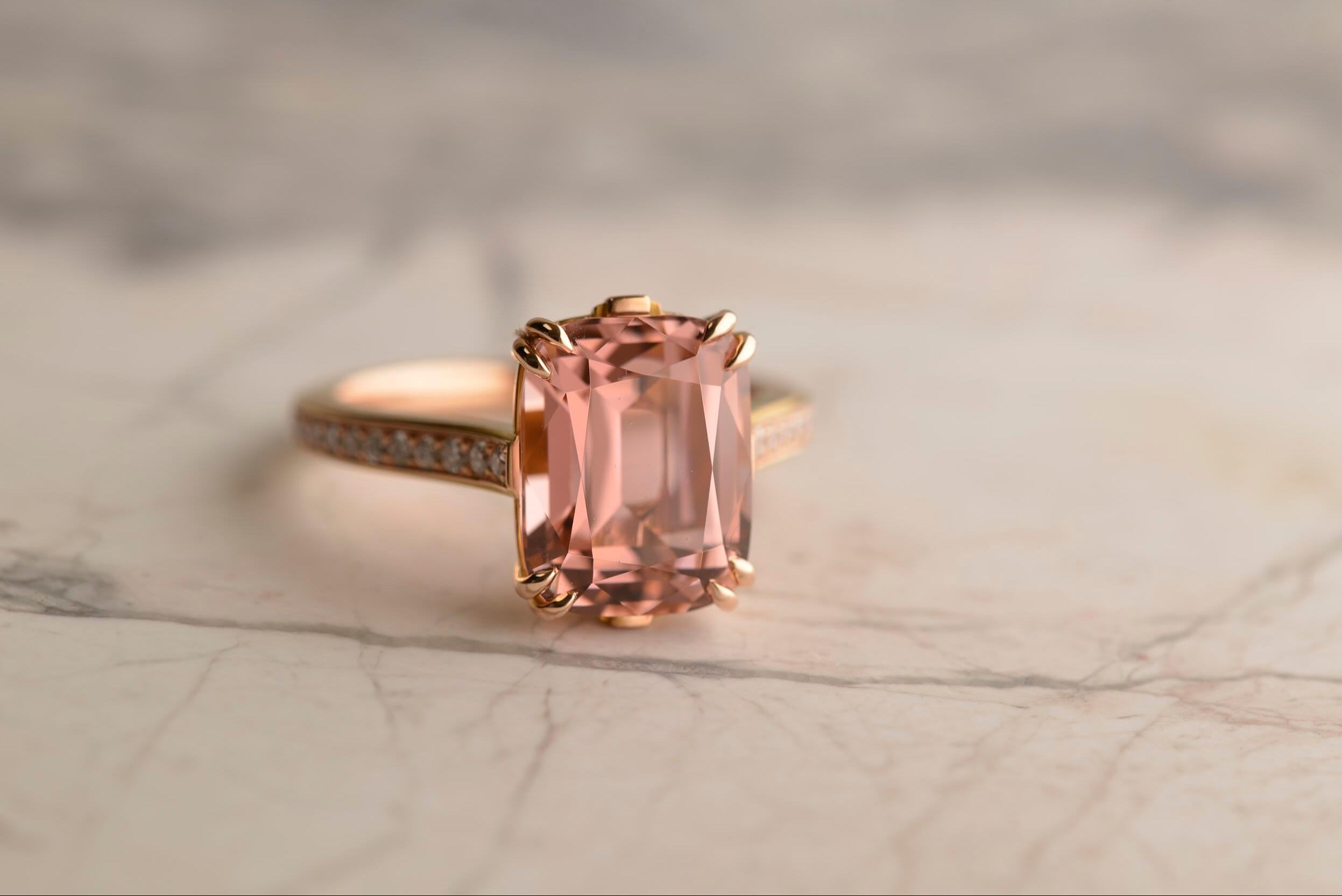 Art deco inspired bespoke rose gold ring featuring a 5.56ct pink antique cushion cut Afghan tourmaline set in double claws and with 36 diamonds set on the band. Handmade by Sydney jeweller Nicky Burles.