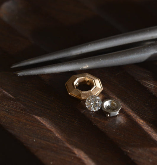 Handmade geometric rose gold and platinum settings, with a diamond for bespoke ring by Sydney jeweller Nicky Burles