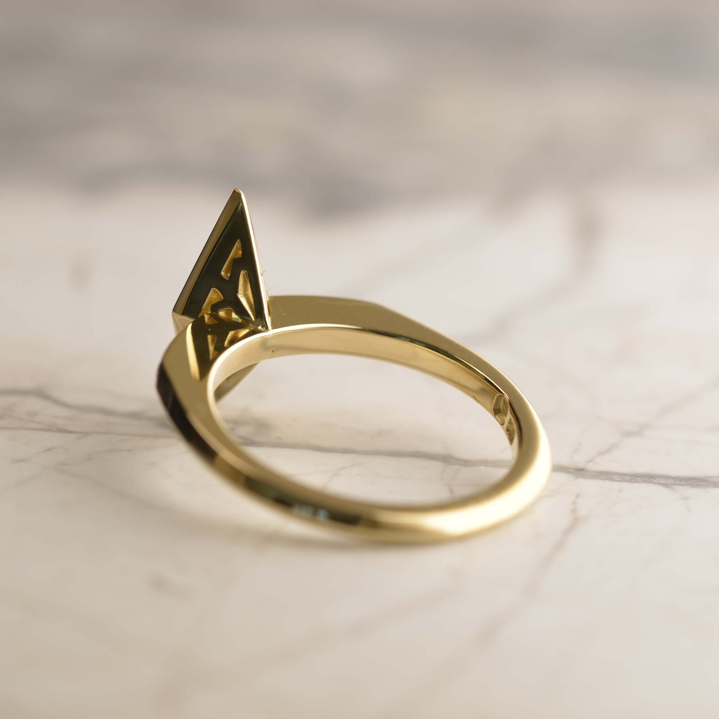 Side view of diamond cut golden Australian sapphire ring basket featuring a deco style star motif that has been hand pierced. Handmade in 18ct gold by Sydney jeweller Nicky Burles.